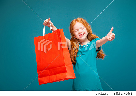 Pretty, cute little girl in blue clothes with long Pretty, cute little girl in blue clothes with long 38327662