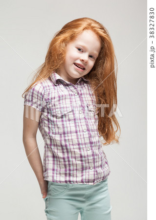 Cute redhead little girl in plaid shirt, bright Cute redhead little girl in plaid shirt, bright 38327830