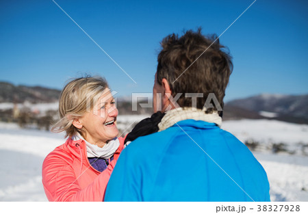 Senior couple jogging in winter nature. Senior couple jogging in winter nature. 38327928