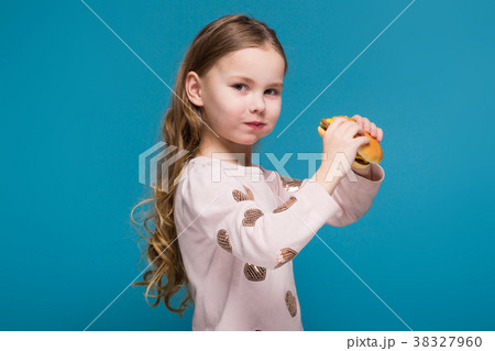 Pretty, little girl in sweater with brunet hair 38327960