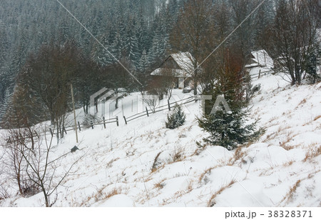 Early morning winter mountain village landscape 38328371