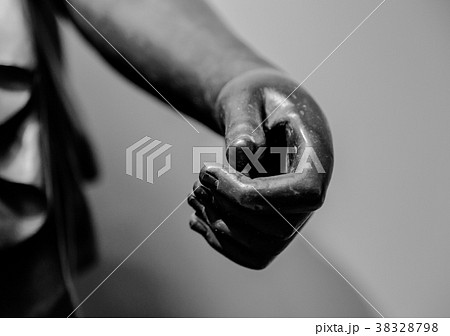stone statue detail of human hand 38328798