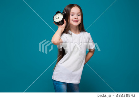 Cute girl in tee shirt with long hair hold the 38328942