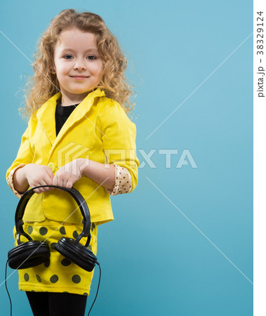 Cute young girl in earphones 38329124