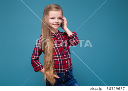 Cute girl in shirt with long hair hold the phone Cute girl in shirt with long hair hold the phone 38329677