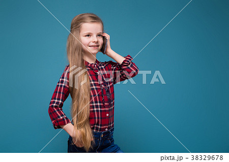 Pretty girl in shirt with long hair hold the phone 38329678