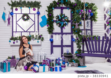 beautiful brunette in a black dress playing on the 38330941