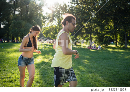 Man and woman dancing Latin American in park Man and woman dancing Latin American in park 38334093