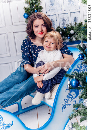two sisters in Christmas decorations smiles two sisters in Christmas decorations smiles 38334308