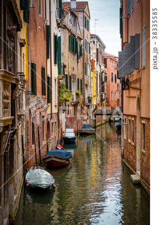 Old narrow street with a boats in Venice, Italy Old narrow street with a boats in Venice, Italy 38335585