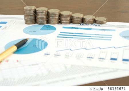 Business chart with paper clips, coins and pen Business chart with paper clips, coins and pen 38335671