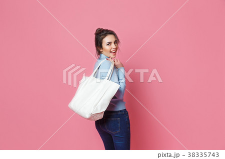 Cheerful casual woman with bag 38335743