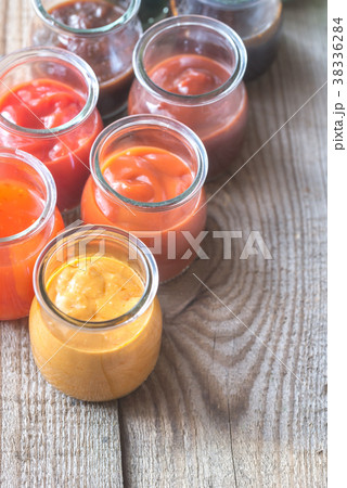 Assortment of sauces in the glass jars 38336284