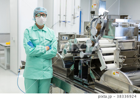 scientist is standing near machine with shafts 38336924