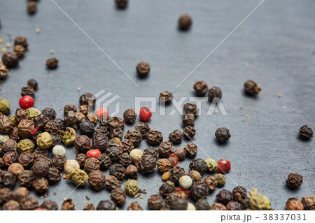 Allspice seeds isolated on dark background 38337031