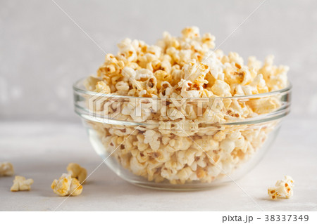 Golden caramel popcorn in glass bowl, copy space. Golden caramel popcorn in glass bowl, copy space. 38337349