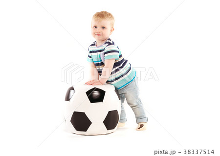 little boy plays with a soccer ball little boy plays with a soccer ball 38337514