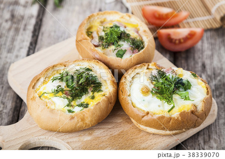 Scrambled eggs with cheese and bacon Scrambled eggs with cheese and bacon 38339070