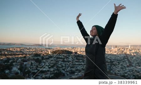 teen girl enjoys sunset on Twin Peaks at Sun 38339961