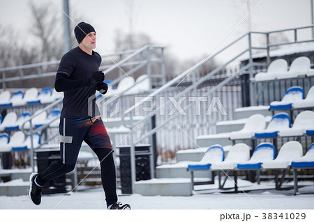 Image of running athlete in black clothes at Image of running athlete in black clothes at 38341029
