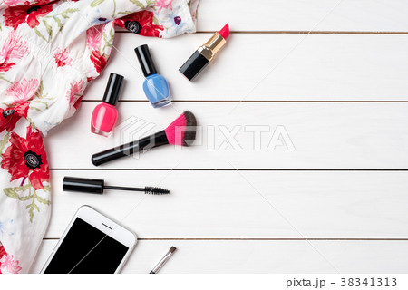 Makeup products on white wooden table 38341313