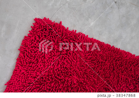 Gray concrete floor with red rug fluffy carpet Gray concrete floor with red rug fluffy carpet 38347868