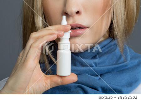 Sick woman taking care of her health Sick woman taking care of her health 38352502