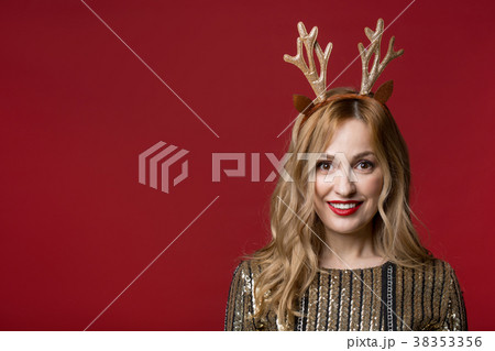 Cheerful blonde girl in festive clothes 38353356