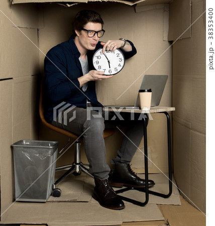 Young positive manager is keeping clock 38353400