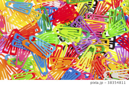 Many Colored Paper Clips on White. 38354811