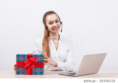 girl in a white blouse with a headset on his head 38356218