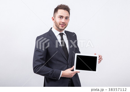 smiling successful young specialist on a white smiling successful young specialist on a white 38357112