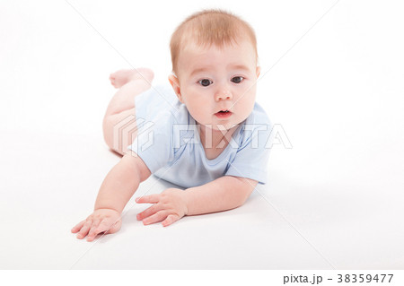 baby in the body lying on his stomach on a white 38359477
