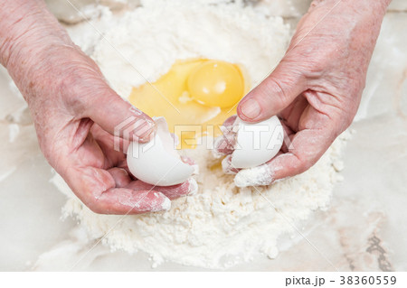 Hands grandmother prepare dough 38360559