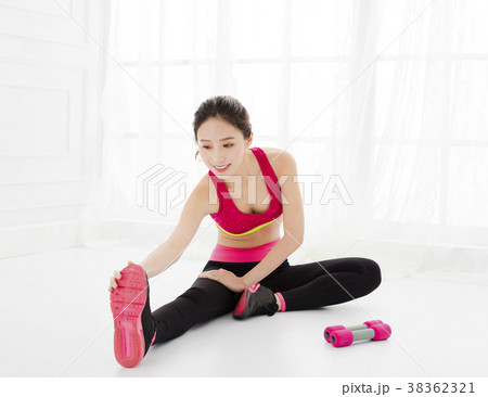 attractive young woman exercising in the room. attractive young woman exercising in the room. 38362321