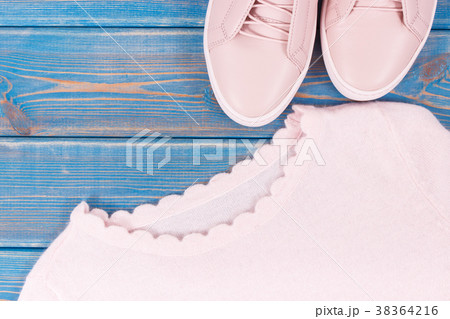 Womanly clothing and accessories on old boards 38364216