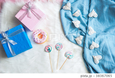 Gifts and candies locating on carpet Gifts and candies locating on carpet 38367065