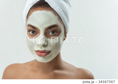 Calm female with caring of her skin Calm female with caring of her skin 38367367