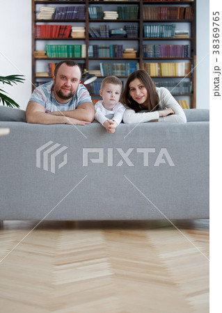Image of happy woman and man with boys on gray 38369765