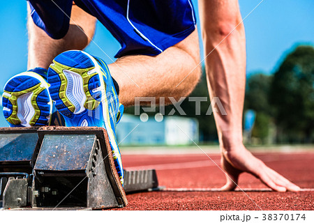 Runner before start signal on starting block of 38370174