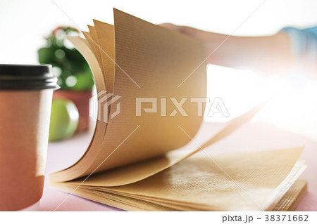 The business woman in the workplace flips through 38371662