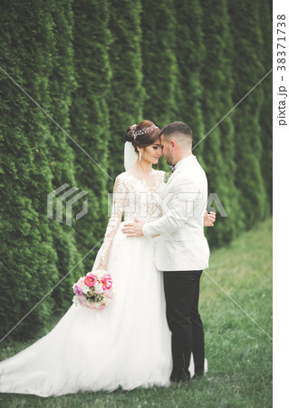 Romantic, fairytale, happy newlywed couple hugging 38371738