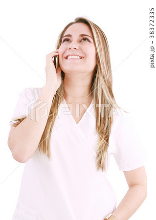 Medical professional talking on her mobile phone 38372335
