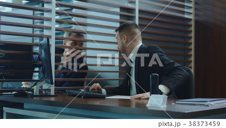 Businessman asking colleague for advice Businessman asking colleague for advice 38373459