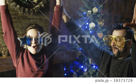 Excited man with son blowing up crackers 38373729