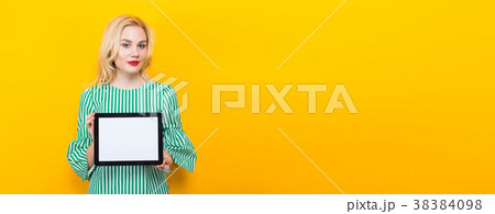 Blonde woman holding tablet computer 38384098