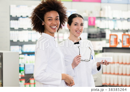 Portrait of a African-American pharmacist next to 38385264
