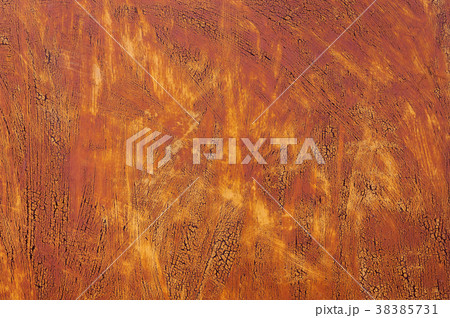 Textured background of a faded yellow paint with 38385731