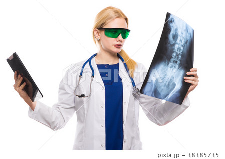 Woman doctor with X-ray and tablet Woman doctor with X-ray and tablet 38385735