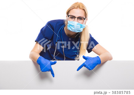 Woman doctor in blue scrubs and gloves with face Woman doctor in blue scrubs and gloves with face 38385785
